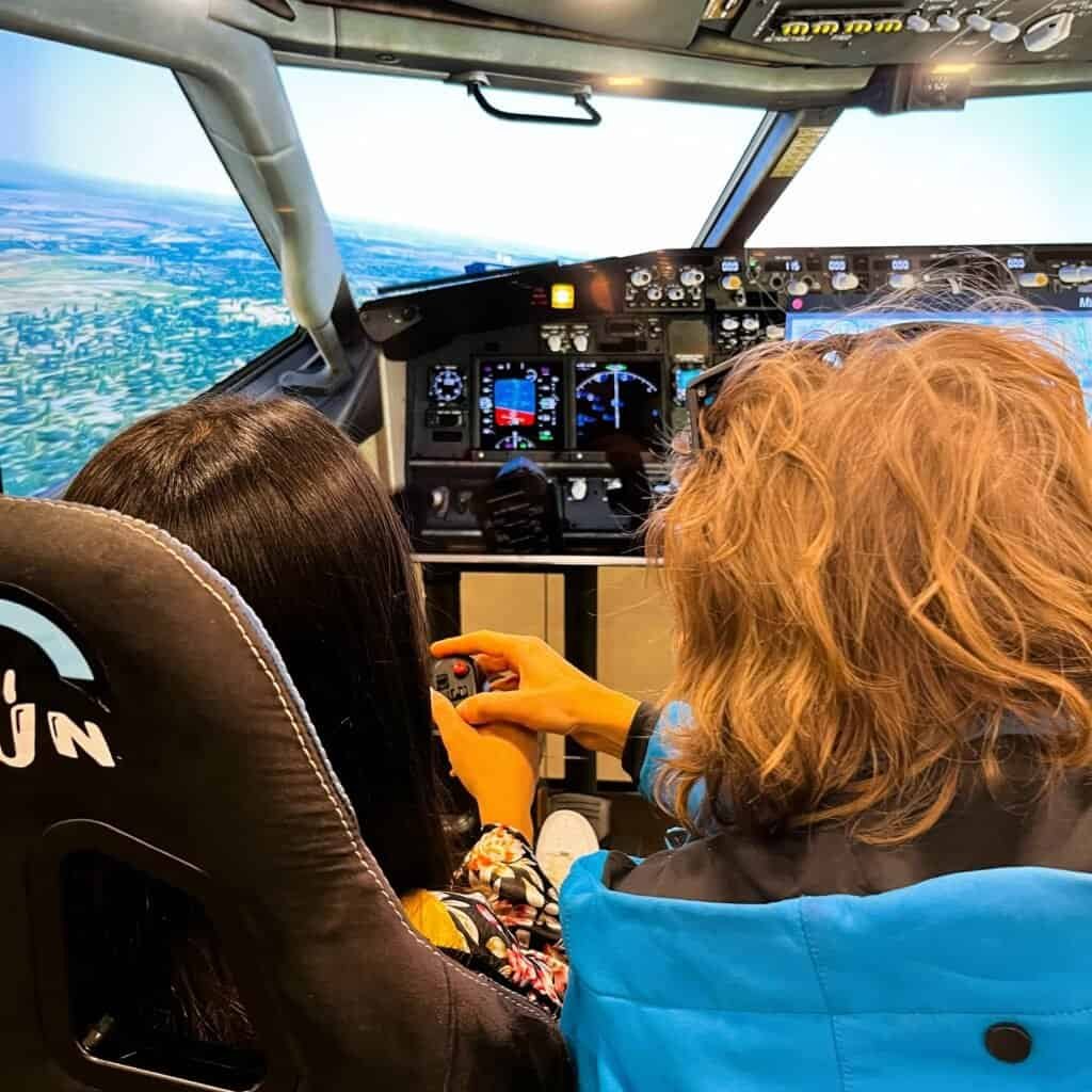 Dr. Max RoarFun BrandMe emotional branding flight experience with Boeing flight motion simulator in Japan flying together.
