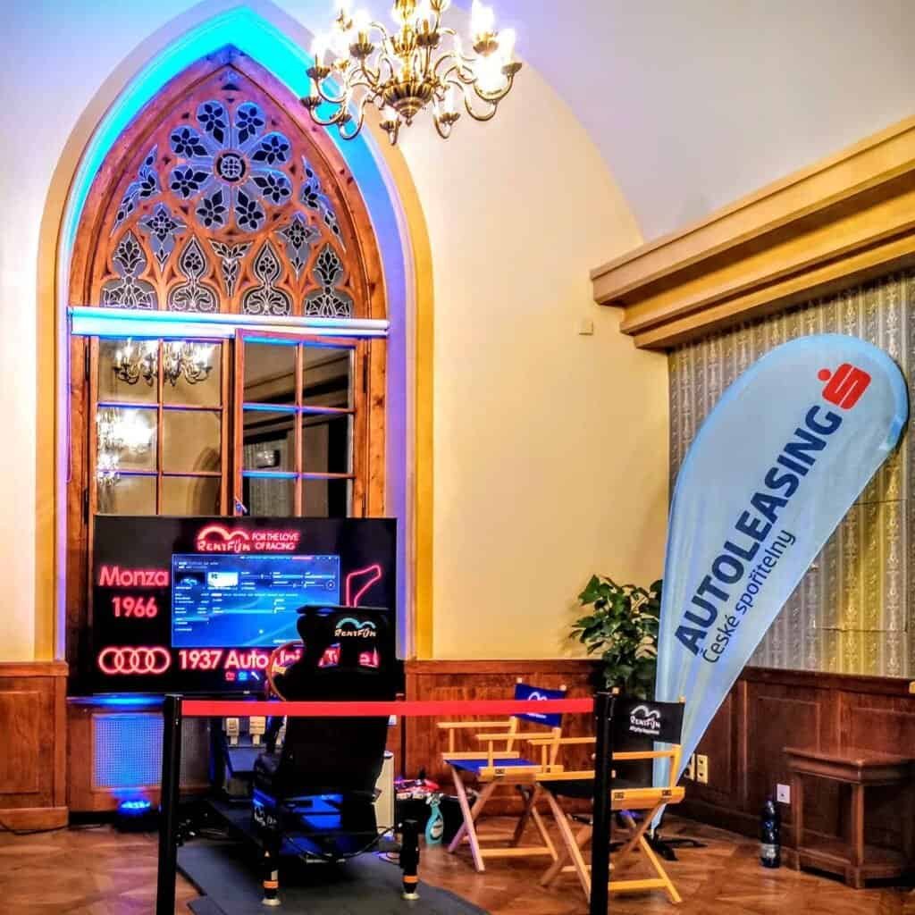 Virtual reality vintage motion racing simulator rental located in old castle on Ceska sporitelna Autoleasing event in Prague.